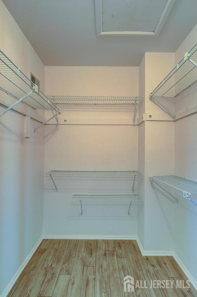 277 Edgeware Ct, Franklin, NJ 08873 - walk in closet with wood finished floors
