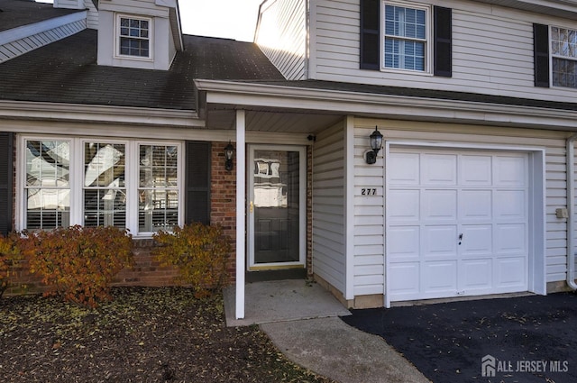 277 Edgeware Ct, Franklin, NJ 08873 - view of exterior entry with an attached garage