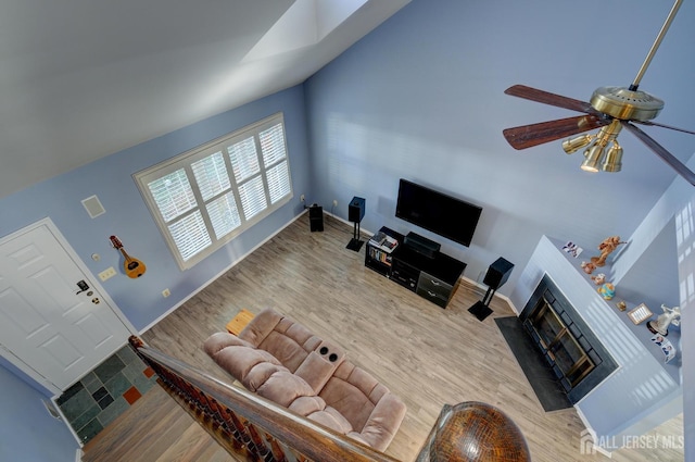 277 Edgeware Ct, Franklin, NJ 08873 - living area featuring wood finished floors, a fireplace with flush hearth, and ceiling fan