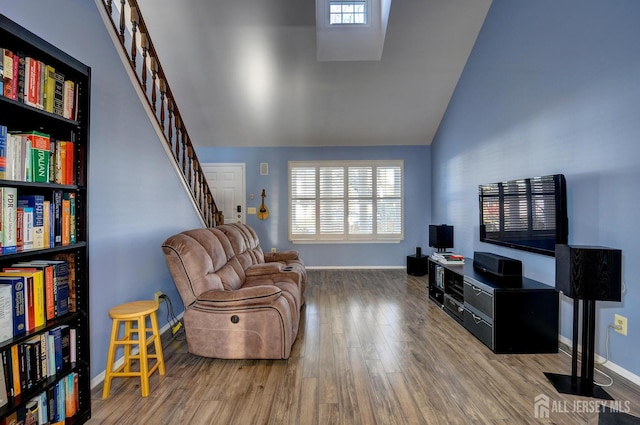 277 Edgeware Ct, Franklin, NJ 08873 - sitting room featuring wood finished floors, high vaulted ceiling, and stairway