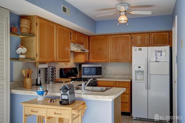 277 Edgeware Ct, Franklin, NJ 08873 - kitchen with white fridge with ice dispenser, under cabinet range hood, stainless steel microwave, light countertops, and ceiling fan