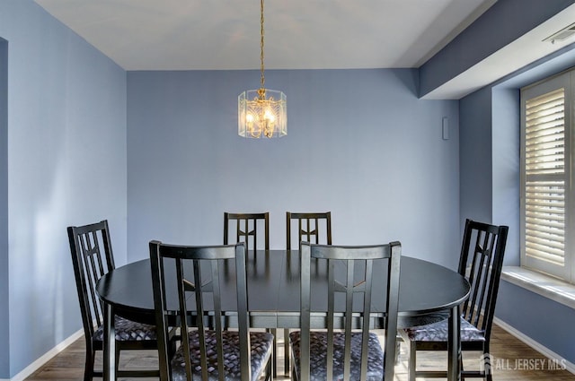 277 Edgeware Ct, Franklin, NJ 08873 - dining space with dark wood finished floors and a chandelier