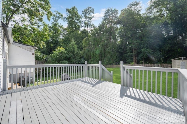 wooden deck with a yard