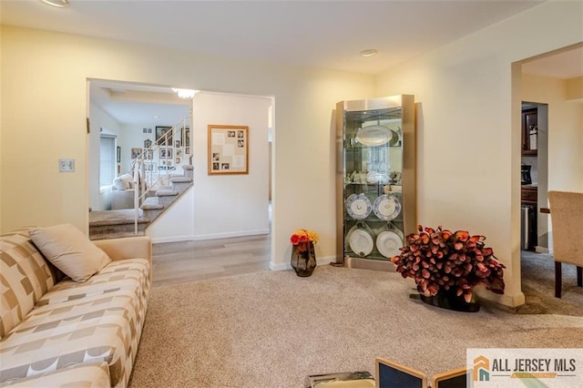 64 Netherwood Cir, Edison, NJ 08820 - carpeted living room with stairway and baseboards