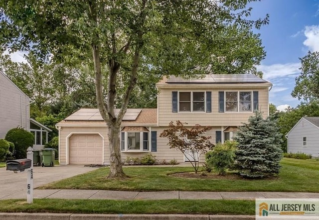 64 Netherwood Cir, Edison, NJ 08820 - colonial-style house with solar panels, concrete driveway, an attached garage, and a front lawn