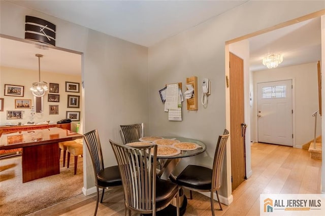 64 Netherwood Cir, Edison, NJ 08820 - dining area with a chandelier and light wood-style floors