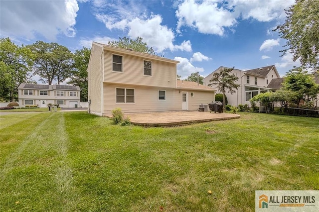 64 Netherwood Cir, Edison, NJ 08820 - rear view of property featuring a lawn and a patio area