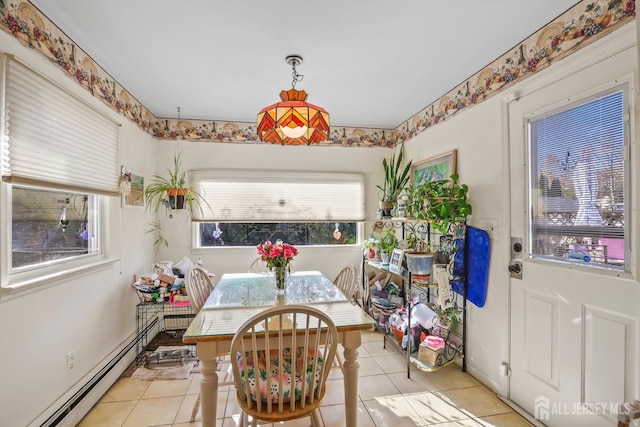 dining space featuring baseboard heating and light tile patterned flooring