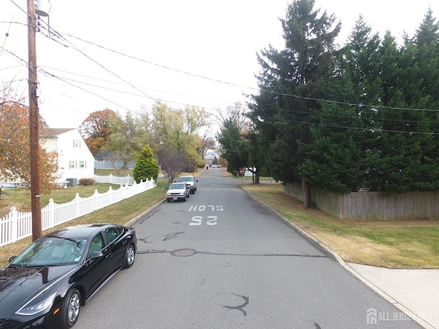 view of street featuring curbs