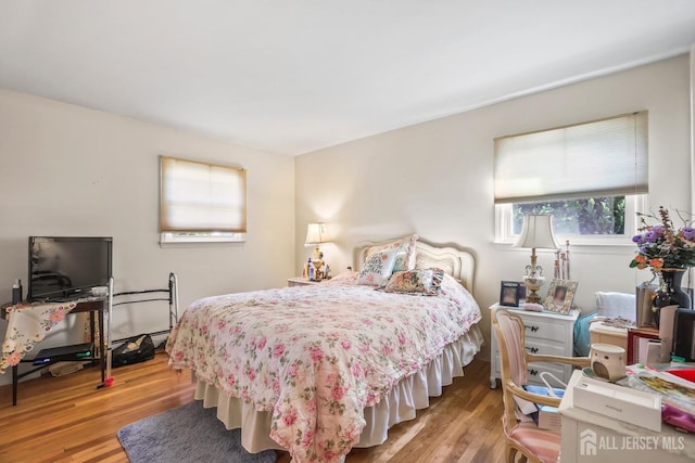 bedroom featuring light wood-style flooring