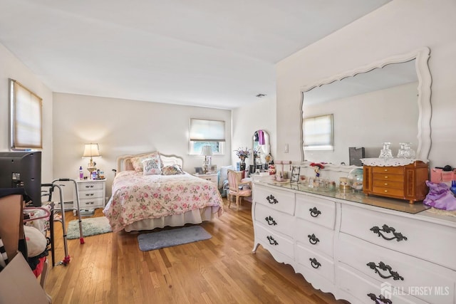 bedroom with light wood-type flooring