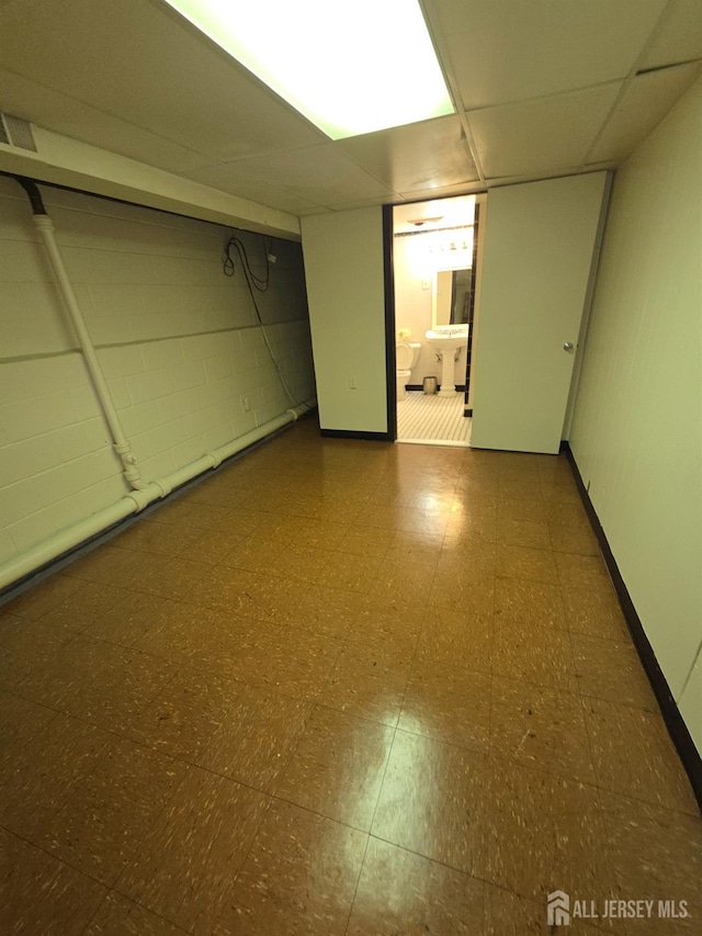 410 Harvard St, Piscataway, NJ 08854 - finished basement with tile patterned floors and concrete block wall