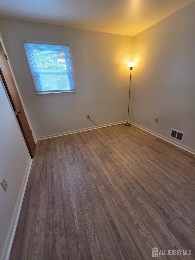 410 Harvard St, Piscataway, NJ 08854 - unfurnished room featuring wood finished floors and baseboards