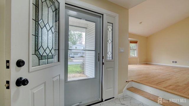 1487 Columbia Dr, North Brunswick, NJ 08902 - entryway with baseboards, vaulted ceiling, and light marble finish flooring