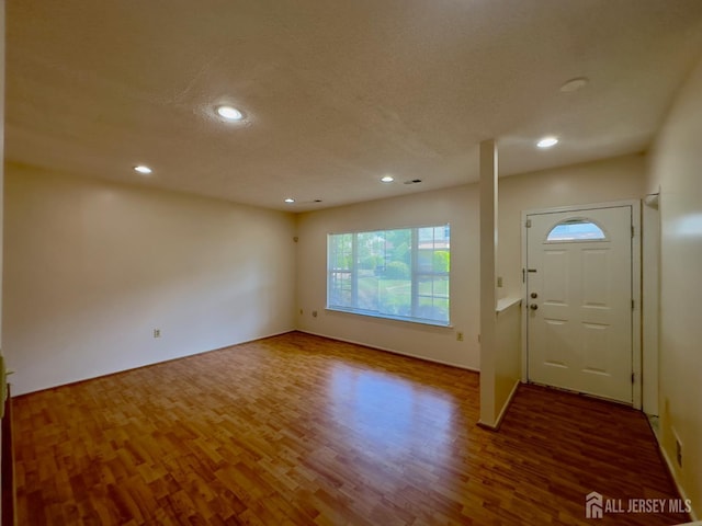 16 Sassafras Ct, North Brunswick, NJ 08902 - foyer featuring wood finished floors, recessed lighting, and a textured ceiling