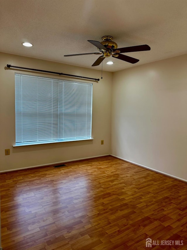 16 Sassafras Ct, North Brunswick, NJ 08902 - unfurnished room with ceiling fan, wood finished floors, recessed lighting, and a textured ceiling