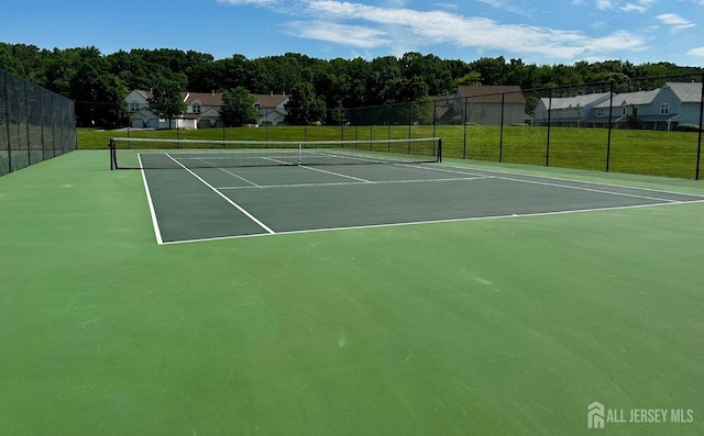 16 Sassafras Ct, North Brunswick, NJ 08902 - view of tennis court with community basketball court and a residential view