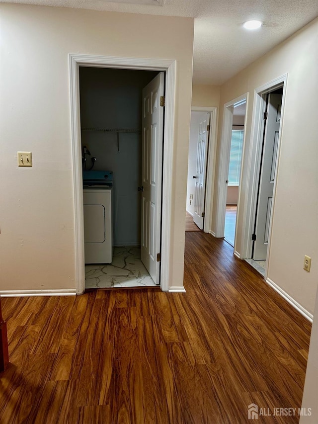 16 Sassafras Ct, North Brunswick, NJ 08902 - corridor featuring wood finished floors and washer / dryer