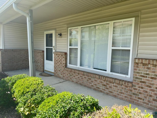 16 Sassafras Ct, North Brunswick, NJ 08902 - property entrance with brick siding and covered porch
