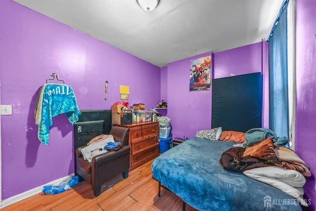 bedroom featuring hardwood / wood-style flooring