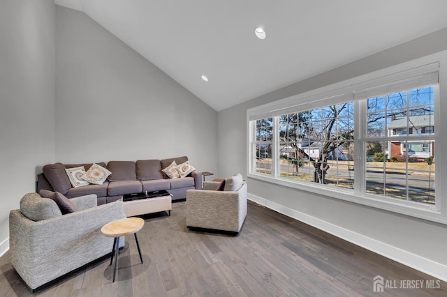 living area with recessed lighting, baseboards, lofted ceiling, and wood finished floors