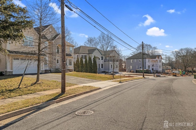 view of road featuring a residential view, curbs, and sidewalks