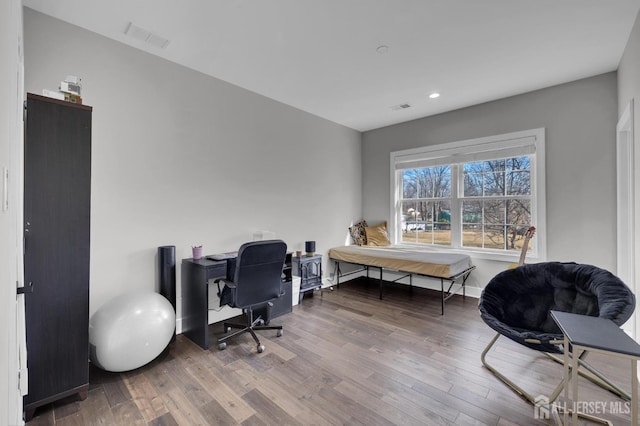 home office featuring visible vents, recessed lighting, baseboards, and wood finished floors