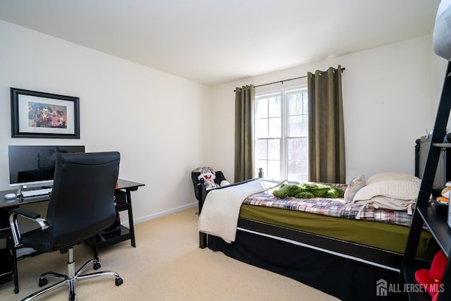 carpeted bedroom with baseboards