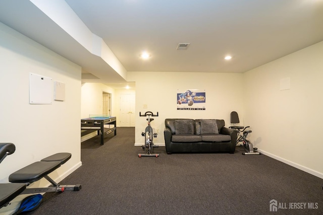 exercise area featuring baseboards, visible vents, and recessed lighting