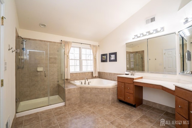 full bath featuring vaulted ceiling, a stall shower, vanity, and a bath