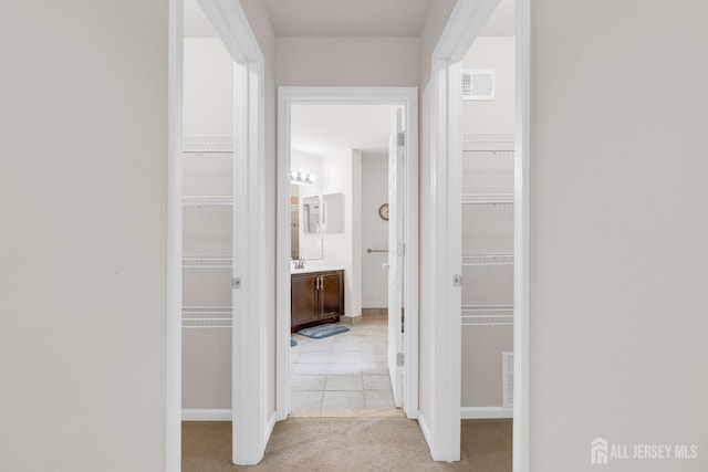 1206 Fir Ct, Franklin Twsp, NJ 08873 - hallway with light colored carpet and baseboards