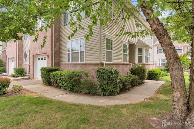 1206 Fir Ct, Franklin Twsp, NJ 08873 - view of side of home featuring brick siding, a garage, and a lawn