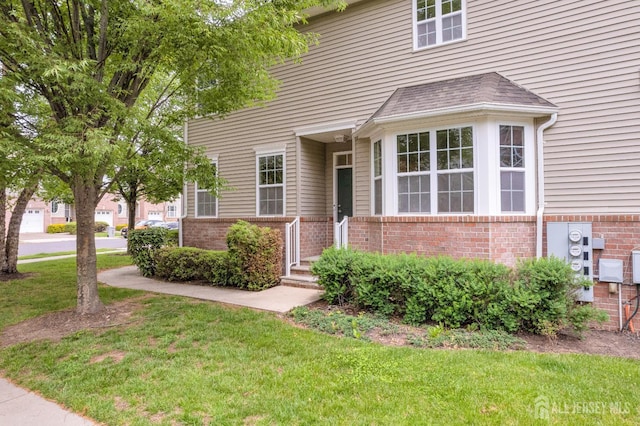 1206 Fir Ct, Franklin Twsp, NJ 08873 - view of front of property with brick siding and a front lawn