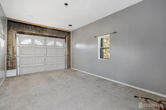 garage featuring baseboards