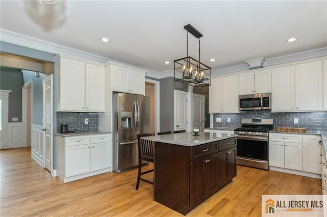 19 Maplehurst Ln, Piscataway, NJ 08854 - kitchen with stainless steel appliances, white cabinetry, decorative backsplash, dark brown cabinets, and light wood finished floors