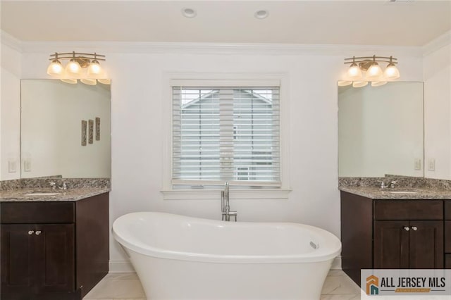 19 Maplehurst Ln, Piscataway, NJ 08854 - bathroom with a freestanding bath, marble look tiles, and two vanities