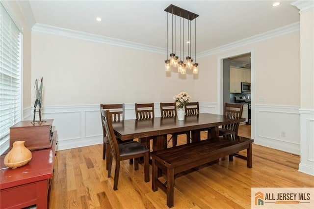19 Maplehurst Ln, Piscataway, NJ 08854 - dining area featuring light wood-style flooring, ornamental molding, wainscoting, a chandelier, and a decorative wall