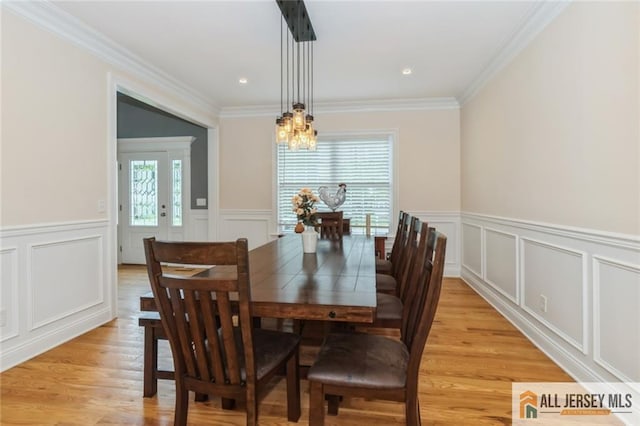 19 Maplehurst Ln, Piscataway, NJ 08854 - dining area featuring a decorative wall, a chandelier, ornamental molding, a wainscoted wall, and light wood-type flooring