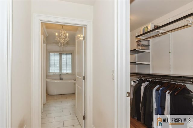 19 Maplehurst Ln, Piscataway, NJ 08854 - spacious closet with a chandelier and marble finish floors