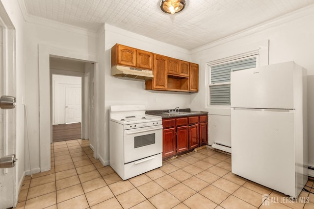 107 N 16th St N, East Orange, NJ 07017 - kitchen featuring white appliances, a baseboard heating unit, under cabinet range hood, ornamental molding, and light tile patterned floors