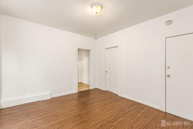 107 N 16th St N, East Orange, NJ 07017 - empty room with wood finished floors, a smoke detector, and baseboards