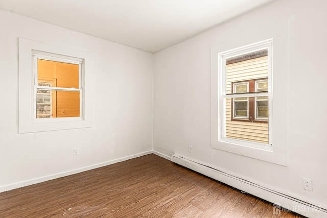 107 N 16th St N, East Orange, NJ 07017 - unfurnished room featuring baseboard heating, dark wood-style floors, and baseboards