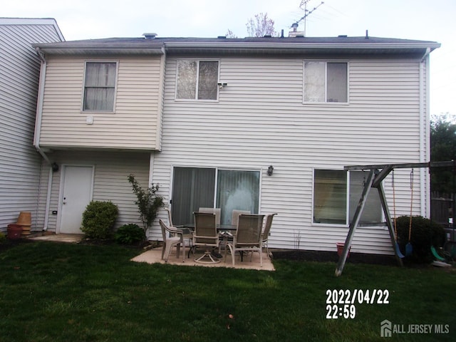 29 Jeffrey Cir S, Brunswick, NJ 08810 - rear view of property featuring a lawn and a patio