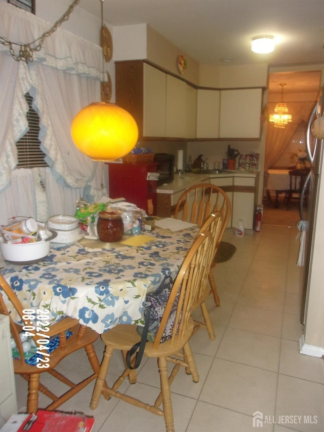 29 Jeffrey Cir S, Brunswick, NJ 08810 - dining room with light tile patterned flooring and a chandelier
