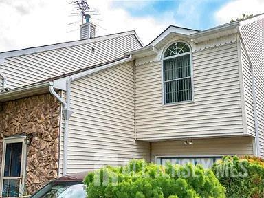 29 Jeffrey Cir S, Brunswick, NJ 08810 - view of property exterior with stone siding