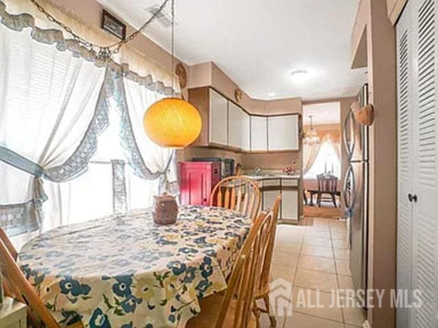 29 Jeffrey Cir S, Brunswick, NJ 08810 - dining room with light tile patterned floors