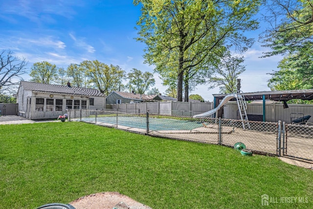 exterior space with a fenced backyard, a fenced in pool, a gate, a playground, and a patio area
