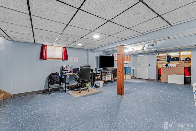 finished below grade area with recessed lighting, a paneled ceiling, and visible vents