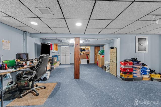 office space with recessed lighting, a paneled ceiling, and electric panel