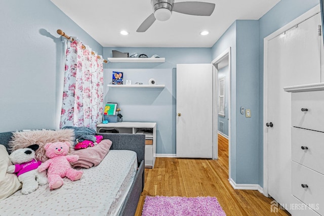 bedroom featuring baseboards, recessed lighting, ceiling fan, and wood finished floors